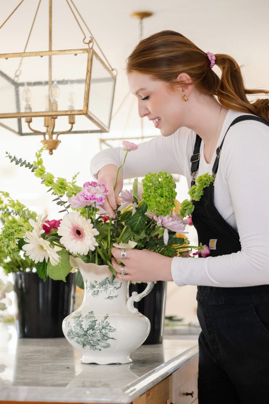 Megan arranging at the counter