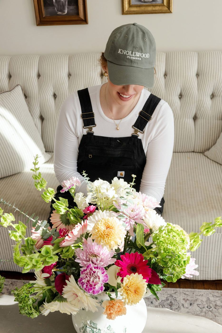 Megan in her Knollwood cap with a bouquet